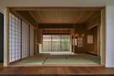 A traditional tatami room with shoji sliding doors is located next to the open-plan living space.