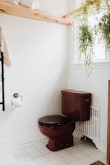 When Chris and Claude bought the home, the maroon toilet was mismatched with a white toilet lid. Although they couldn't find an exact match (even after five tries), the new lid is a much better match than the white.