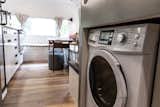 The laundry machine is strategically centered above the axles for optimal weight distribution. 