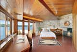 The master bedroom overlooks panoramic views of the lake. 
