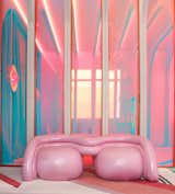 Patricia Bustos Studio designed the BUBBLE GUM sofa made from wood and upholstered in metallic pink fabric.