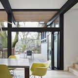 Folding glass doors creates a more seamless connection between the dining room and the outdoor deck.