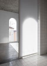 The translucent sliding bathroom door allows light to filter through. 