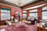 The family room includes a large bay window with original leaded glass and original hardwood floors. 