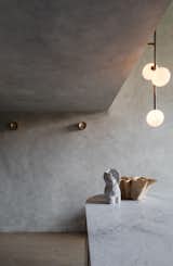 The Anton Mini wall sconces in the entrance hall are also by Volker Haug. 