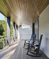 A pair of rocking chairs are perfectly positioned for taking in views of the stream. 