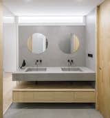 Waxed concrete surfaces define the minimalist bathroom. 