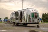 With its original aluminum facade polished to a high shine, the fully restored Airstream is designed to go off-the-grid with rooftop solar panels with an inverter, a composting toilet, and a large water tank.