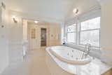 The master bath features a whirlpool tub, two sinks, a water closet with bidet, two sinks, and a steam shower.