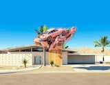 His Labrooy's 911 series, four pink Porsche 911 Carrera RS float as if weightless near a Palm Springs midcentury home.