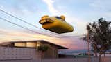 The troublemaking inflatable duck Porsche 911 is seen bouncing around on the telephone wires.