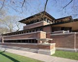 Exterior, Concrete Siding Material, House Building Type, Flat RoofLine, and Brick Siding Material Inspired by the great plains of the midwest, the Frederick C. Robie House in Chicago (constructed 1910) is renowned as the the greatest example of the Prairie School architectural style and the most famous of Wright’s Prairie Houses. 
  Photos from 8 Frank Lloyd Wright Buildings Inducted Into the UNESCO World Heritage List