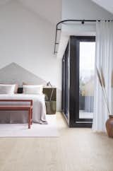 The master bedroom also enjoys access to a private terrace through sliding glazed doors. A privacy curtain can be pulled along the ceiling track. 
