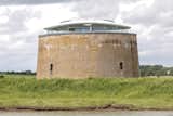 The Martello Tower Y is one of approximately a hundred Martello towers built in the early 19th century along the British coastline to defend against Napoleon's army. 