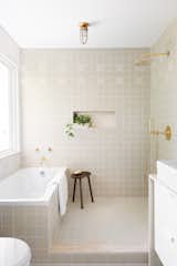 A glimpse into the master bath covered in tile by Heath Ceramics. 