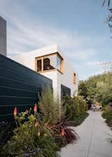 "While the house enjoys its inner garden and cloister-like character, a major aim of the project was to give back to the neighborhood through the creation of a public green space along the property line," says Ryan. "To do so, large sections of the sidewalk around the house were removed and converted to lush planting beds, which the owners tend."