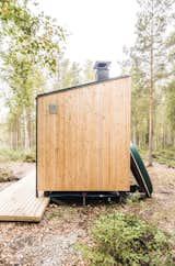 At the far end of the cabin, the duo installed this Finnish necessity: the sauna. The multipurpose space can be accessed through the bedroom or via the outdoor terrace. It serves as a multipurpose space where they can also cook food—such as pike fished from the lake.  
