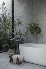 A Falper Quattro Zero bath from Rogerseller overlooks views of greenery in the bathroom. 