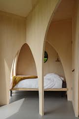 The cabin structure and arches are made of locally sourced poplar plywood. The design team selected this material because of its fast-growing characteristics and wide availability in the Netherlands. "Because they grow fast, there is a lot of water in the tree," add the architects. "During drying, this water is replaced by air—that’s why this wood insulates, and therefore feels warm and pleasant (it is the same wood type used for making clogs). The wood does not splinter, and it is non-toxic."