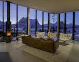 Walls of triple-glazed glass surround the living room, which overlooks two of Norway's most challenging climbing peaks to the south.