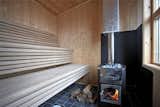 A peek inside the 129-square-foot wood-burning sauna. The building also includes a bathroom with a Cinderella incineration toilet and a mechanical room with a desalination system. 
