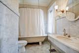 "Expense was not spared on the construction or attention to detail in this home," reads the property listing. Marble was used throughout the home, on fireplaces and in bathrooms such as this one. 