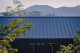 "The whole volume has a double-pitched roof without a drainage channel, which is very helpful during the typhoon season, and also gives the volume a more solid appearance," notes Zeberio.