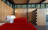 To lend a sense of warmth and for privacy, the architects wrapped the bedroom area with walls of tongue-and-groove vertical grain Douglas fir that matches the ceiling. 