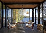 Kawagama Boathouse by Building Arts Architects glass wall living room