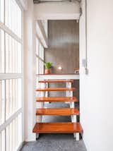 The architects used Makha wood, a timber local to Thailand, for the stair treads.