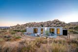 Los Angeles–based writer Leslie Longworth knew she’d found the perfect retreat when she spotted a five-acre lot in Pioneertown. Immersed in the rugged beauty of Joshua Tree with a dirt road for access, it was an ideal creative space. Seeking a low-impact build, she hired prefab company Cover to draft, construct, and install a custom home. The prefab came complete with fixtures, finishes, Wolf Sub-Zero appliances, and a state-of-the-art radiant heating and cooling system. In order to design around endangered Joshua trees, boulders, and the view, Cover used a combination of 3D mapping via drone imagery and handheld photos.