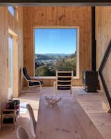 The focal point of the living room is the large southeasterly projecting window that frames views of the town, Hautapu River, and the Ruahine Range. 