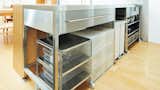 The kitchen is outfitted in Muji storage equipment. 