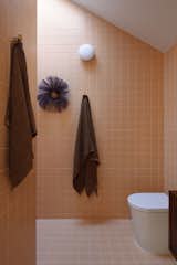 One MANI House orange tile bathroom