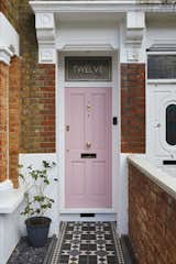 "We couldn't resist this beautiful shade of pink," notes homeowner Richard John Andrews of the door color at this London residence. "It was championed by my wife Kristina, but I didn’t take much convincing. It would also draw a lot of attention and help the house to be easily found by visiting clients and potential new business."