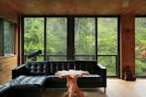 On the second floor, an IKEA leather sectional frames a reminder of their time in the City of Brotherly Love: a tree coffee table the couple purchased from Open House, their favorite boutique store in Philadelphia.
