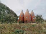 Five Tile-Clad Towers Forge a Fantastical Home Inspired by Hop Kilns
