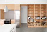 All of the integrated storage units and cabinetry are made of affordable maple veneer panels. 