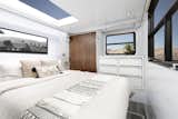 The master bedroom is furnished with a queen bed and a cool-touch 10-inch memory foam mattress beneath a large skylight. Compared to last year’s model, the 2020 Living Vehicle offers two feet of extra space.
