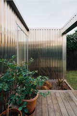 "The void in the veranda and deck creates a spectacular shaft of light that cuts across the shiny aluminum surface, reflecting rippled patterns into the house," adds Mulla.
