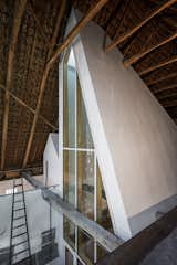 "The inner surface of the original roof is a beautiful structure where they insulated tiles with hay," says Larsen. "If we insulated the entire barn from within, this surface would no longer be visible. Therefore, we decided to build smaller houses within the house so only the necessary spaces were insulated. And then the beautiful, old structure would remain visible."