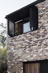 "The recycled brick honors the fabric of the existing cottage whilst adding robustness and patina to complement the rugged terrain of the lake reserve," say the architects. Only recycled bricks were used in the new construction. 