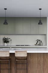 NSW spotted gum surfaces and cabinetry painted with Dulux Forest Canopy give the kitchen a calming, forest-like feel. 