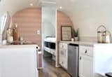 Kerri Cole and Patrick Neely, the husband-and-wife duo behind the Denver-based design studio Colorado Caravan, transformed this 1974 Airstream Overlander for a family of five in just four months. Spoonflower Boho Tile Blush Dark wallpaper by Holli Zollinger adds a pop of color in the kitchen, which features new cabinetry and appliances, including a Furion 2-in-1 range oven.