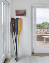 The clients’ paddle collection and surf art are used as decor in the beach-inspired interior. 