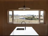 A pair of tilt-and-turn windows flank a fixed window in the kitchen. All glazing is double paned. 