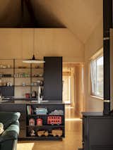 Open shelving in a kitchen island is a great way to maximize storage space. 
