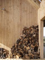 The Outdoor Room stores stacked firewood used for the wood-burning stove in the living room. 