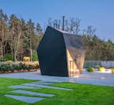 Exterior, Metal Roof Material, Metal Siding Material, and House Building Type Every element and facet of the design was developed with 3D modeling.   Photos from A Family in Poland Adds an Origami-Inspired Retreat to Their Backyard