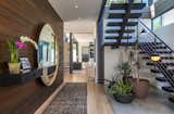 Staircase, Metal Railing, and Wood Tread At the entrance, a staircase with charred oak treads leads up to the master suite.   Photo 5 of 15 in Will Arnett Lists His Prefab-Hybrid Home in Beverly Hills for $11M